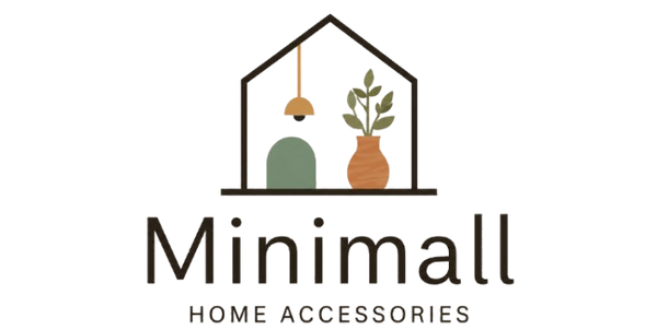 A minimalist logo for 'Minimall HOME ACCESSORIES' featuring a stylized house outline containing a hanging pendant light, a green arch-shaped decor piece, and a potted plant, on a solid white background.